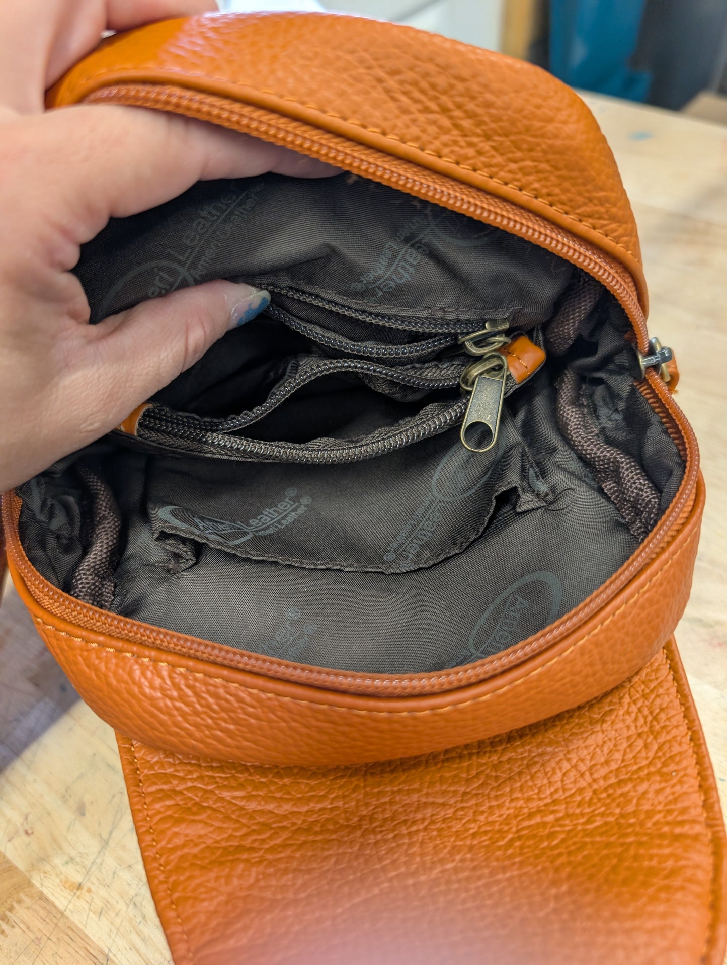Amerileather petite sling bag burnt orange color
